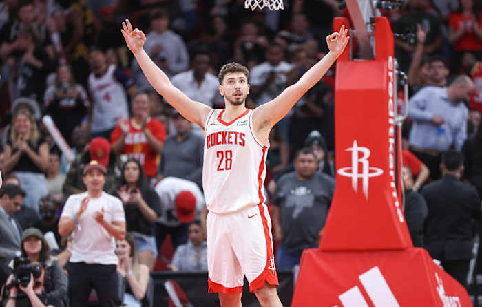 Rockets center Alperen Sengun (28) celebrates after scoring a basket during the fourth quarter against the San Antonio Spurs at Toyota Center.